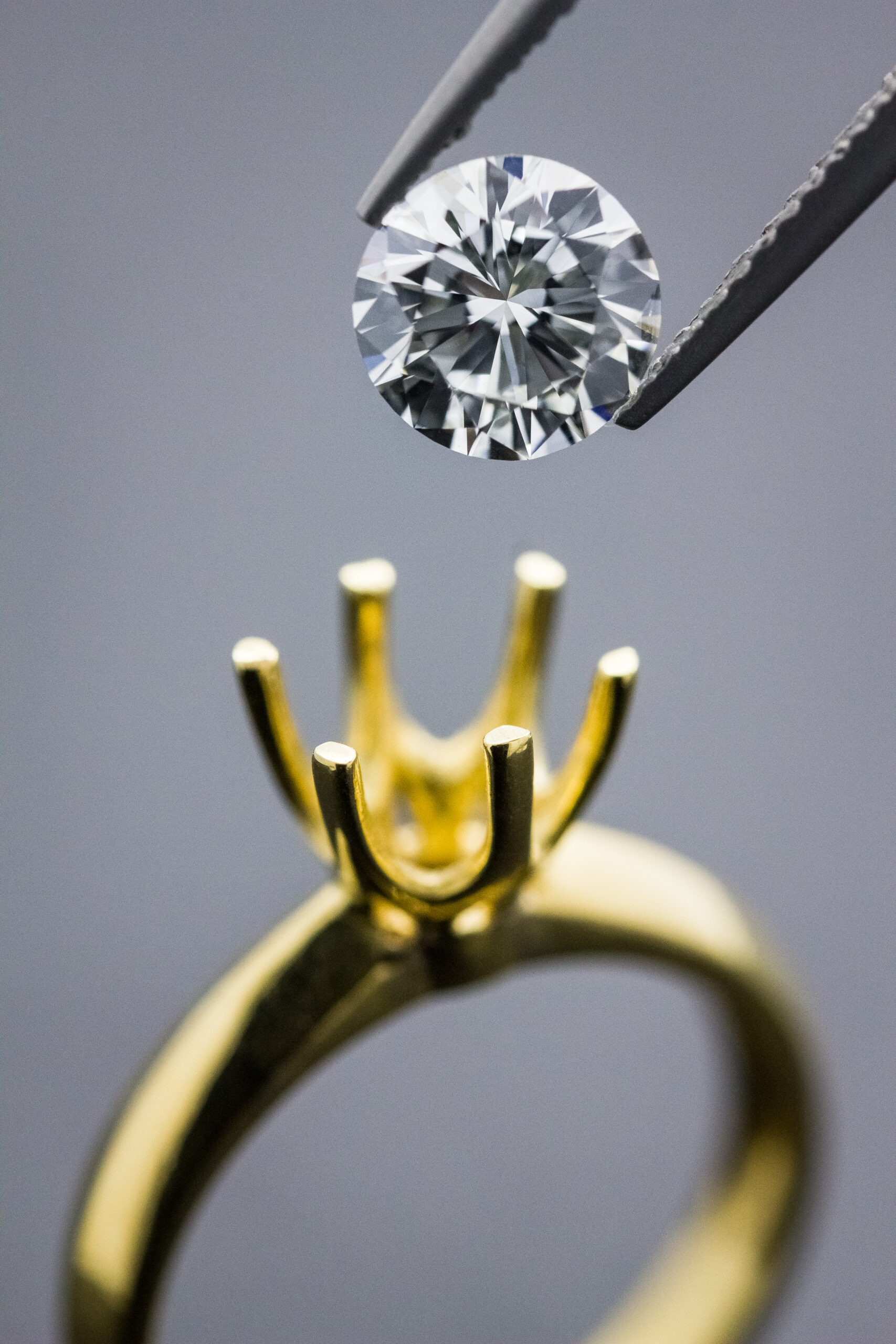 Diamond being set into 18K gold ring — CB Jewelry